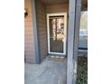 Exterior view of the front entrance, featuring a welcome mat, a screen door and gray columns at 7945 Edgebrook Cir # B, North Charleston, SC 29418