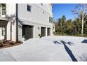 Spacious three-car garage with ample parking space and well-maintained surroundings at 8638 Scottish Troon Ct, North Charleston, SC 29420