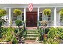 Charming front entrance with lush greenery, plants, and manicured landscaping at 10 Water St, Charleston, SC 29401