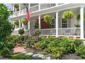 Beautiful Charleston home with a lush front garden and double porch at 10 Water St, Charleston, SC 29401