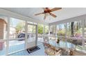Cozy screened porch with a ceiling fan and outdoor furniture at 103 Haleswood Cir, Goose Creek, SC 29445