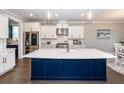 Modern kitchen with stainless steel appliances, custom cabinets, and large island at 1166 Elliotts Cut Dr, Charleston, SC 29412