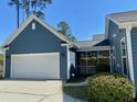 Attached two-car garage with a white door, offering convenience and ample parking at 1659 Seabago Dr, Charleston, SC 29414