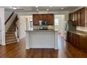 Open-concept kitchen featuring wooden cabinets, granite countertops, and stainless steel appliances at 1659 Seabago Dr, Charleston, SC 29414
