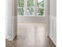 Bright entryway with natural light and beautiful hardwood floors and decorative wainscotting at 1683 Cultivation Ln # 460, Mount Pleasant, SC 29466