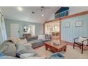 Open living room with vaulted ceiling flows into dining area and features a comfortable sectional sofa at 1706 W Avalon Cir, Charleston, SC 29407