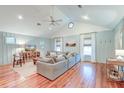 Bright living room features high vaulted ceilings, wood floors, and modern decor at 1706 W Avalon Cir, Charleston, SC 29407