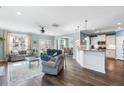 Expansive living room with natural light, connecting seamlessly to the dining area and modern kitchen at 1826 Towne St, Johns Island, SC 29455