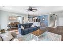Comfortable living room with ceiling fan, open to the dining room and kitchen, providing a harmonious flow at 1826 Towne St, Johns Island, SC 29455