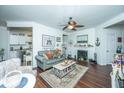 Bright living room featuring a fireplace, comfortable seating, nautical decor, and an open floor plan at 1928 Chatelain Way, Mount Pleasant, SC 29464