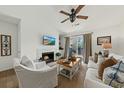 Inviting living area featuring a cozy fireplace and ample natural light at 2011 N Highway 17 # 1100I, Mount Pleasant, SC 29466