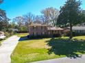 Beautiful two-story brick home with a long driveway and a spacious front lawn at 2467 Birkenhead Dr, Charleston, SC 29414