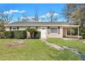 Inviting single-story home with a covered carport, manicured lawn and easy access at 3564 Blanding Dr, Johns Island, SC 29455
