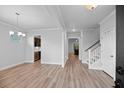 Bright living room with hardwood floors, staircase, and sight lines into other rooms of the home at 460 Cool Bend Ln, Summerville, SC 29486