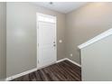 Bright entryway boasts wood-look floors and a white front door with transom window at 4809 Bushel Rd, Ladson, SC 29456