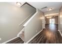 Spacious entryway featuring hardwood floors and stairs leading to the upper level at 4809 Bushel Rd, Ladson, SC 29456