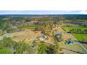 Wide aerial shot showcasing the home's location within a vast, wooded area at 614 Cummings Chapel Rd, Ridgeville, SC 29472