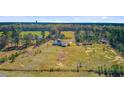 Expansive aerial view of the property, highlighting its extensive land and surroundings at 614 Cummings Chapel Rd, Ridgeville, SC 29472