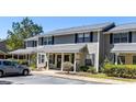 Townhome exterior featuring neutral siding, a covered porch, and well-maintained landscaping at 915 Dills Bluff Rd # 39, Charleston, SC 29412