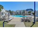 Resort-style pool featuring lounge chairs and umbrellas offers a relaxing outdoor oasis at 1012 Rosewood Ln, Mount Pleasant, SC 29464