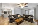 Spacious living room with a comfortable sofa set, neutral color palette, and access to the kitchen at 102 Kingsbridge Dr, Goose Creek, SC 29445