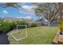Lush green backyard with new mulch and a soccer net, perfect for outdoor activities and relaxation at 105 Chadwick Dr, Charleston, SC 29407