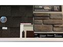 Exterior selections showcasing roofing, siding, stone, and door stain samples at 111 Grange Cir, Summerville, SC 29486