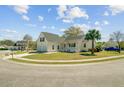 Inviting home featuring a two-car garage, a charming porch, and a beautifully landscaped yard at 112 Retriever Ln, Goose Creek, SC 29445