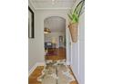 Inviting entryway with hardwood floors, arched doorway, and a view into the stylish living room at 1298 French Santee Rd, Jamestown, SC 29453