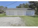 A large detached three-car garage features white siding and trim at 1298 French Santee Rd, Jamestown, SC 29453