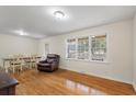Bright living room featuring hardwood floors, ample natural light, and a cozy seating area at 1404 Ivy Isle Dr, Charleston, SC 29412