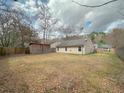 Spacious backyard with wooden fence and storage shed, perfect for outdoor activities and storage at 154 Tabby Creek Cir, Summerville, SC 29486