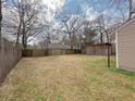 Large, enclosed backyard featuring a wooden fence and storage shed for outdoor activities and additional storage at 154 Tabby Creek Cir, Summerville, SC 29486