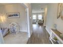 Hallway view showcasing the open floor plan connecting to the living area at 1540 Dawn Mist Way, Charleston, SC 29414