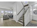 Bright, open staircase with white railings and wood accents, leading to a spacious living area with natural light at 181 Ashworth Dr, Summerville, SC 29486