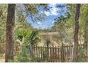 Backyard view showing wooded area and fence at 1844 Hubbell Dr, Mount Pleasant, SC 29466