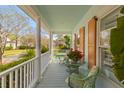 Relaxing porch with comfortable seating and view of the neighborhood at 205 Fairchild St, Daniel Island, SC 29492
