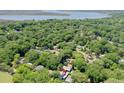 Stunning aerial shot of the home nestled among trees, near waterways, with lush surrounding nature at 2142 Golfview Dr, Charleston, SC 29412