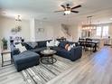 Spacious living room featuring a comfortable sectional sofa and hardwood floors at 251 Summers Dr, Summerville, SC 29485