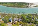 Breathtaking aerial view featuring stunning waterfront homes with private boat docks and lush surroundings at 3121 Marshgate Dr, Johns Island, SC 29455