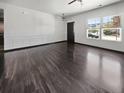 Bright living room featuring sleek hardwood floors, modern trim, and large windows allowing natural light at 359 Dunlin Dr, Summerville, SC 29486