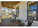 Relaxing front porch with rocking chairs, offering a cozy outdoor space to enjoy the neighborhood view at 3858 Sawyers Island Dr, Mount Pleasant, SC 29466