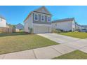 Beautiful two-story home featuring a two-car garage and manicured landscaping at 436 Thoroughbred Dr, Moncks Corner, SC 29461
