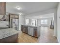 Modern kitchen with stainless steel appliances, granite countertops, and a center island at 436 Thoroughbred Dr, Moncks Corner, SC 29461