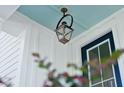 A lantern style porch light with light blue ceiling at 475 Queenview Ln, Charleston, SC 29414