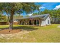 Charming home with a metal roof, welcoming front porch and an inviting American flag at 508 Horse Trail Rd, Saint George, SC 29477