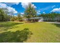 Expansive, well-maintained yard surrounding a charming single-Gathering home with mature trees at 508 Horse Trail Rd, Saint George, SC 29477