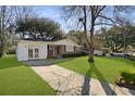 Charming brick home with a well-manicured lawn and mature trees at 5314 Albert St, North Charleston, SC 29418