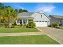 Inviting single-story home with a well-kept lawn and convenient two-car garage at 566 Four Seasons Blvd, Summerville, SC 29486