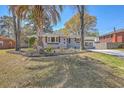 Charming single-story home with painted brick, decorative shutters, and landscaped front yard at 6009 Meadowcliff Ave, Hanahan, SC 29410